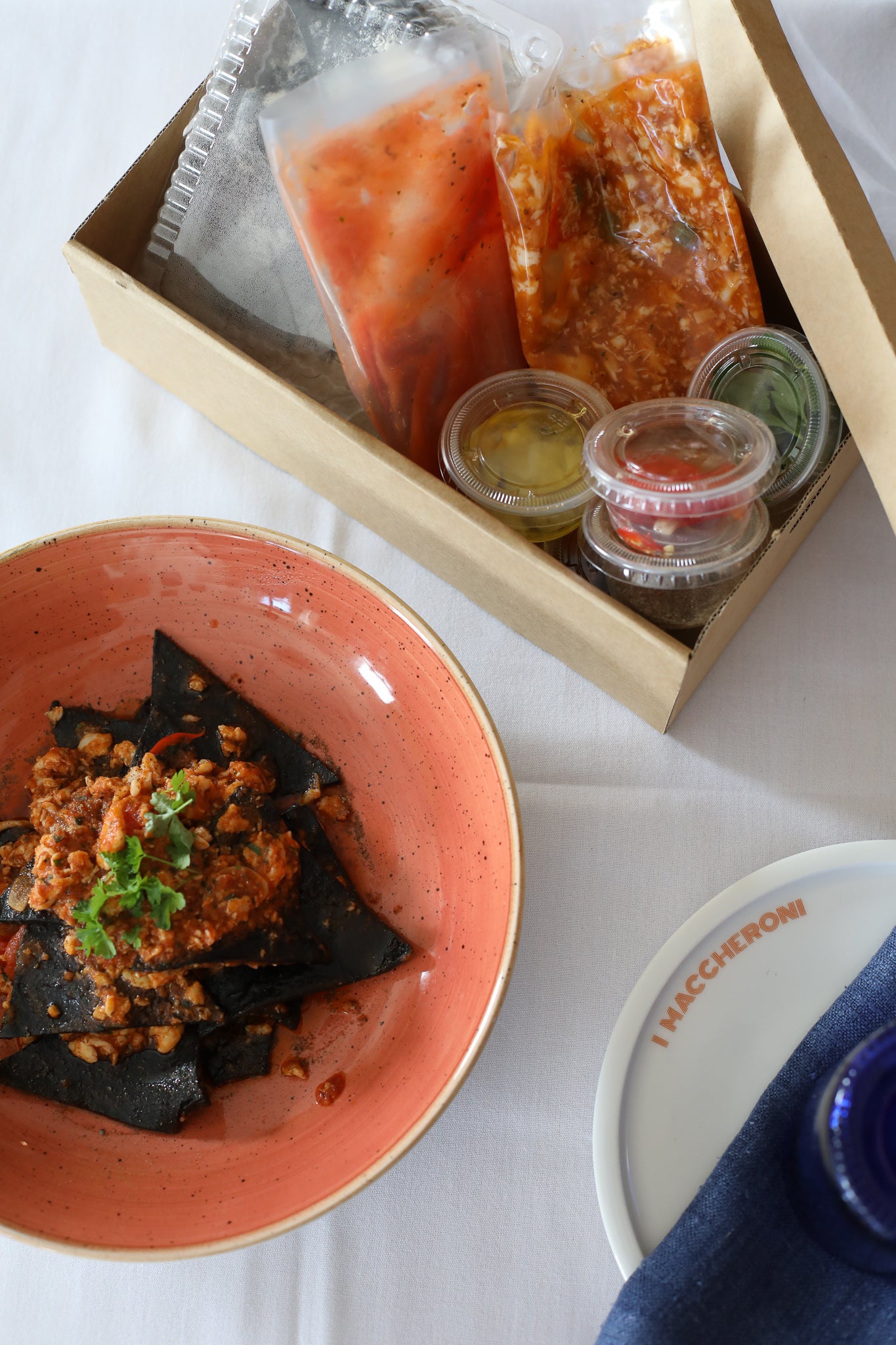 Black Squid Ink Tagliolini, chilli, garlic, Crab ragout, tomato, capers dust, parsley