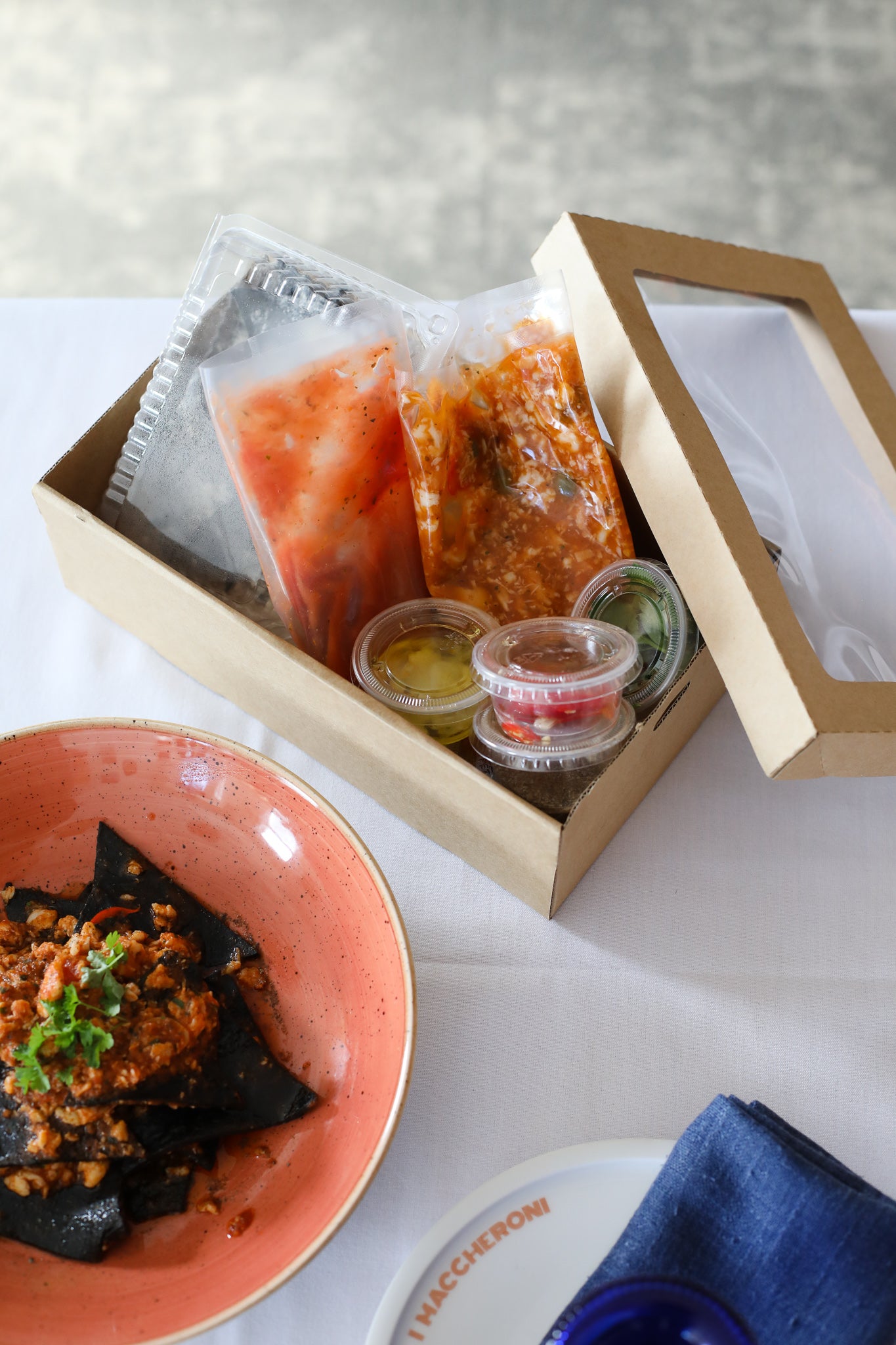 Black Squid Ink Tagliolini, chilli, garlic, Crab ragout, tomato, capers dust, parsley