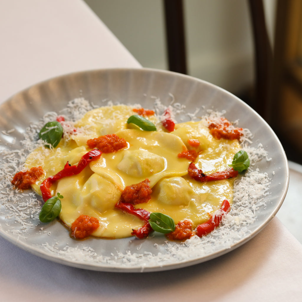 Basil e Ricotta Bottoni, chilli pate', vodka, leek, peppers, basil & oregano (Vegetarian)