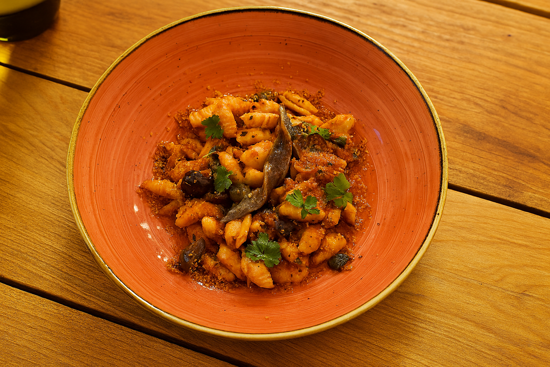 Cavatelli alla Puttanesca, garlic, tomato, olives, capers, anchovy, parsley, chilli crumbs (PS)