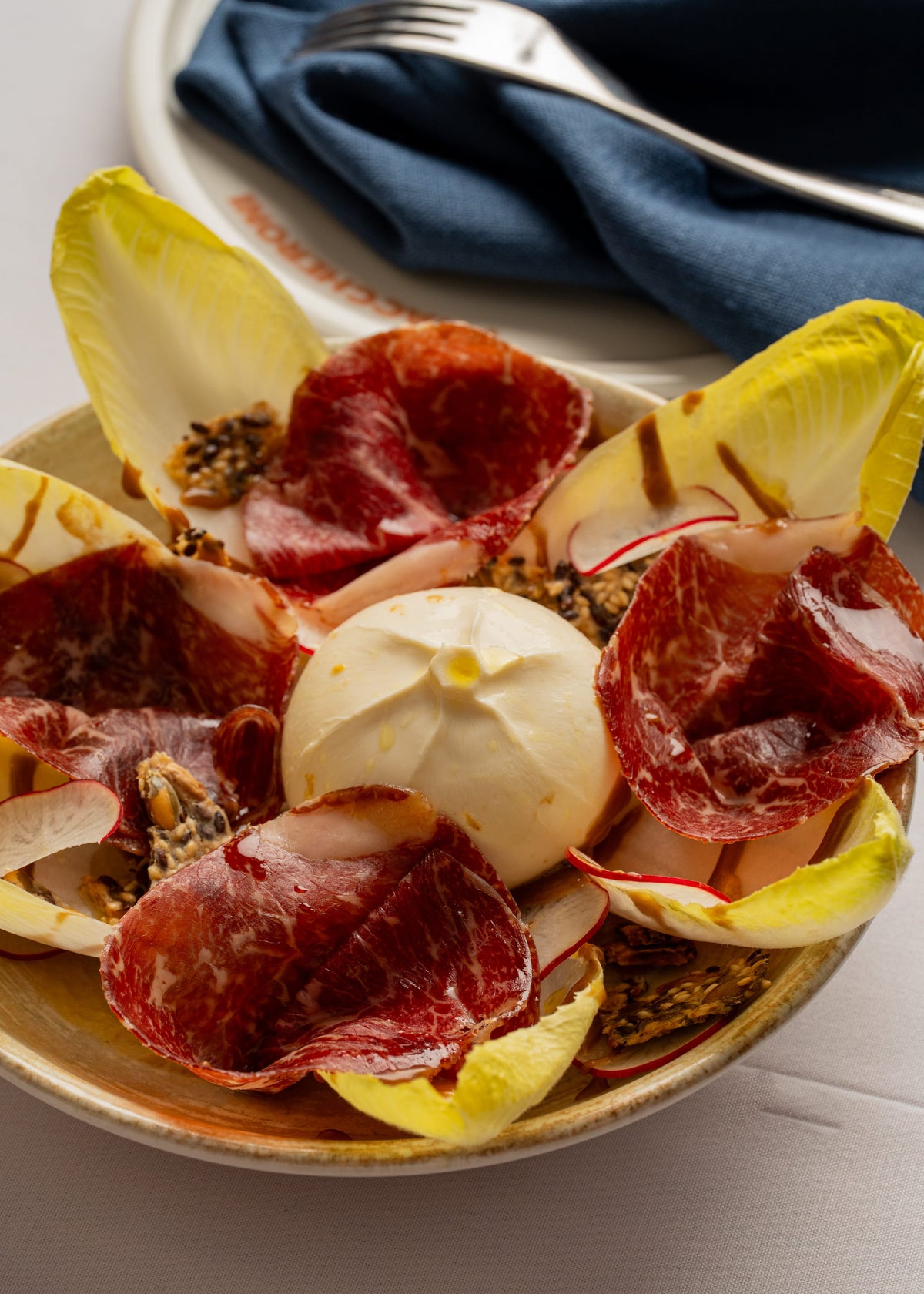 Burrata, seasonal leaves, figs dressing, seeded cracker, wagyu bresaola