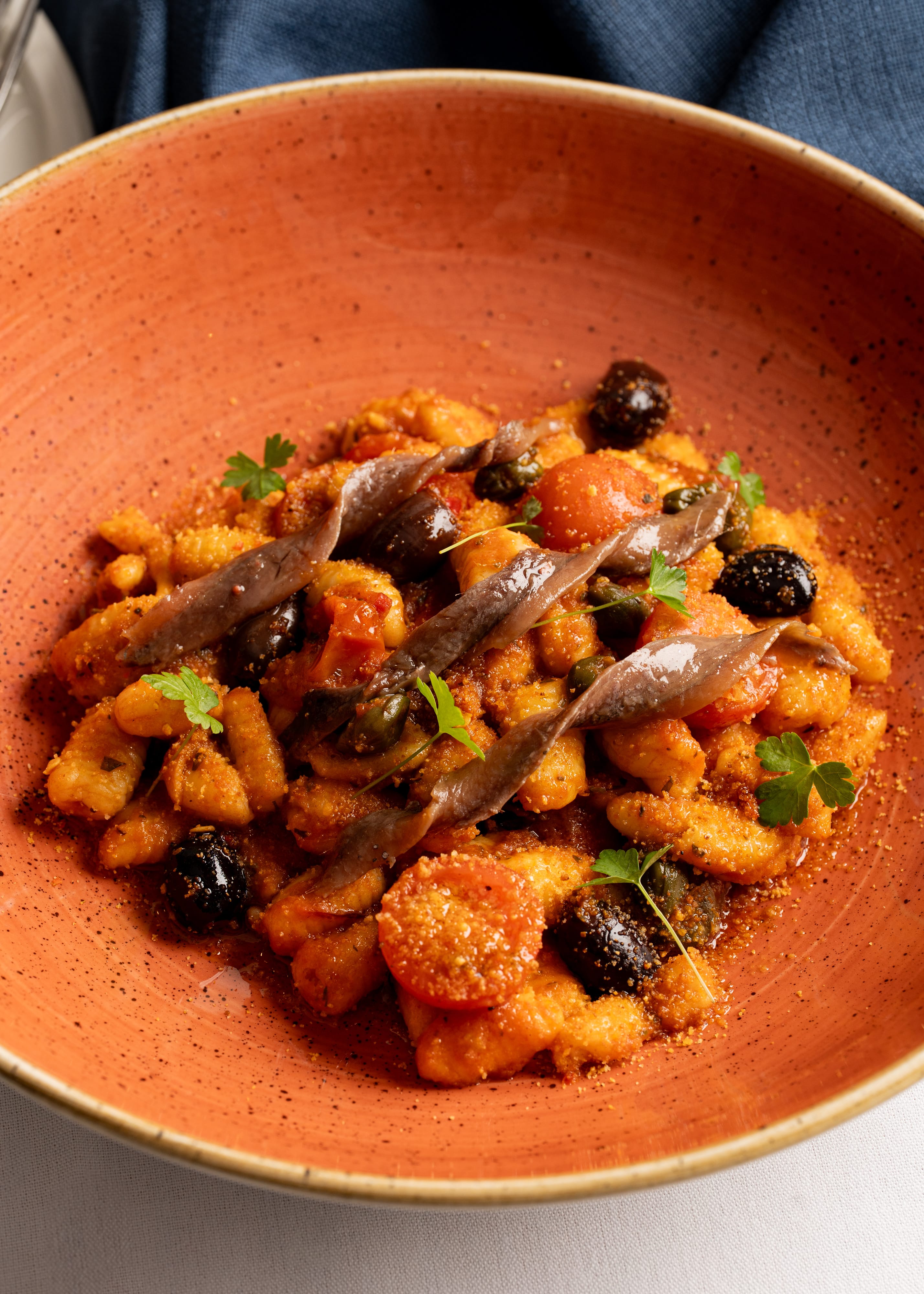 Cavatelli alla puttanesca, anchovy, capers, olives, tomato