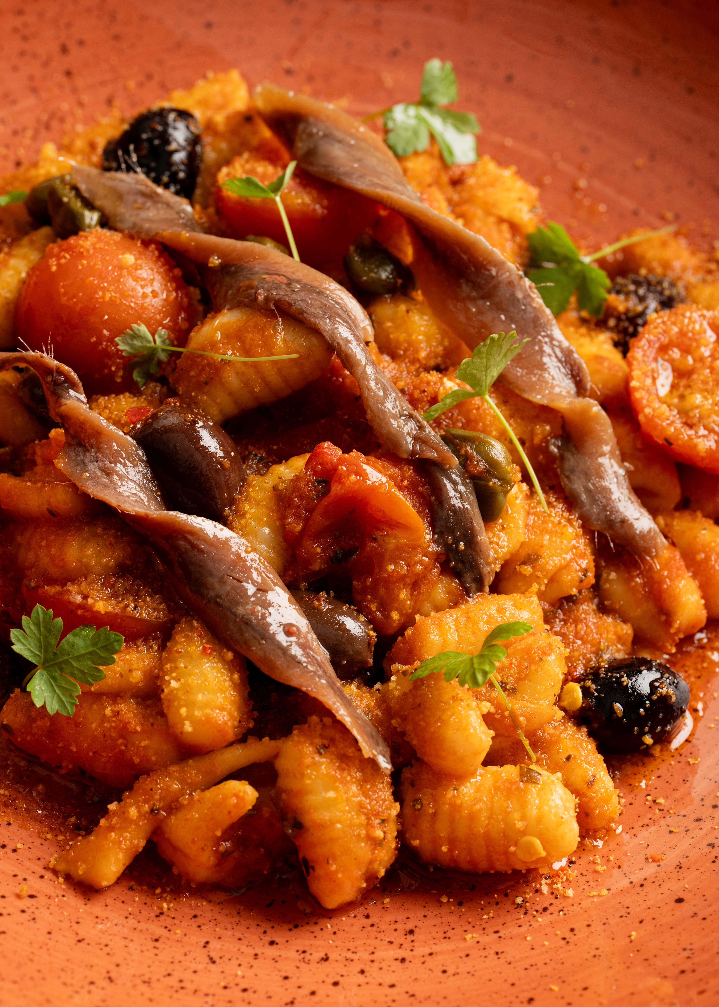 Cavatelli alla puttanesca, anchovy, capers, olives, tomato