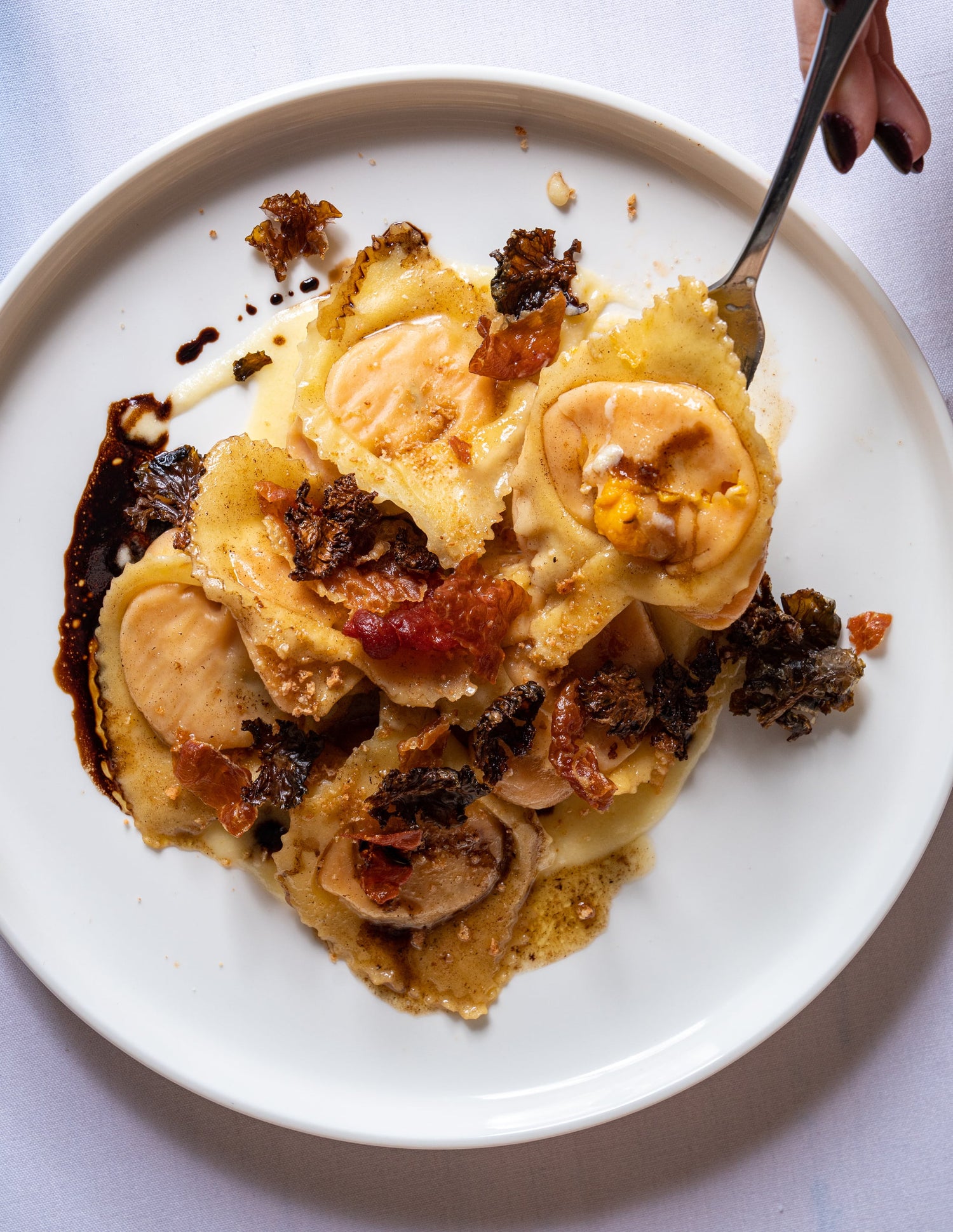 Pumpkin ravioli, leek puree, parma prosciutto, kale, parmigiano